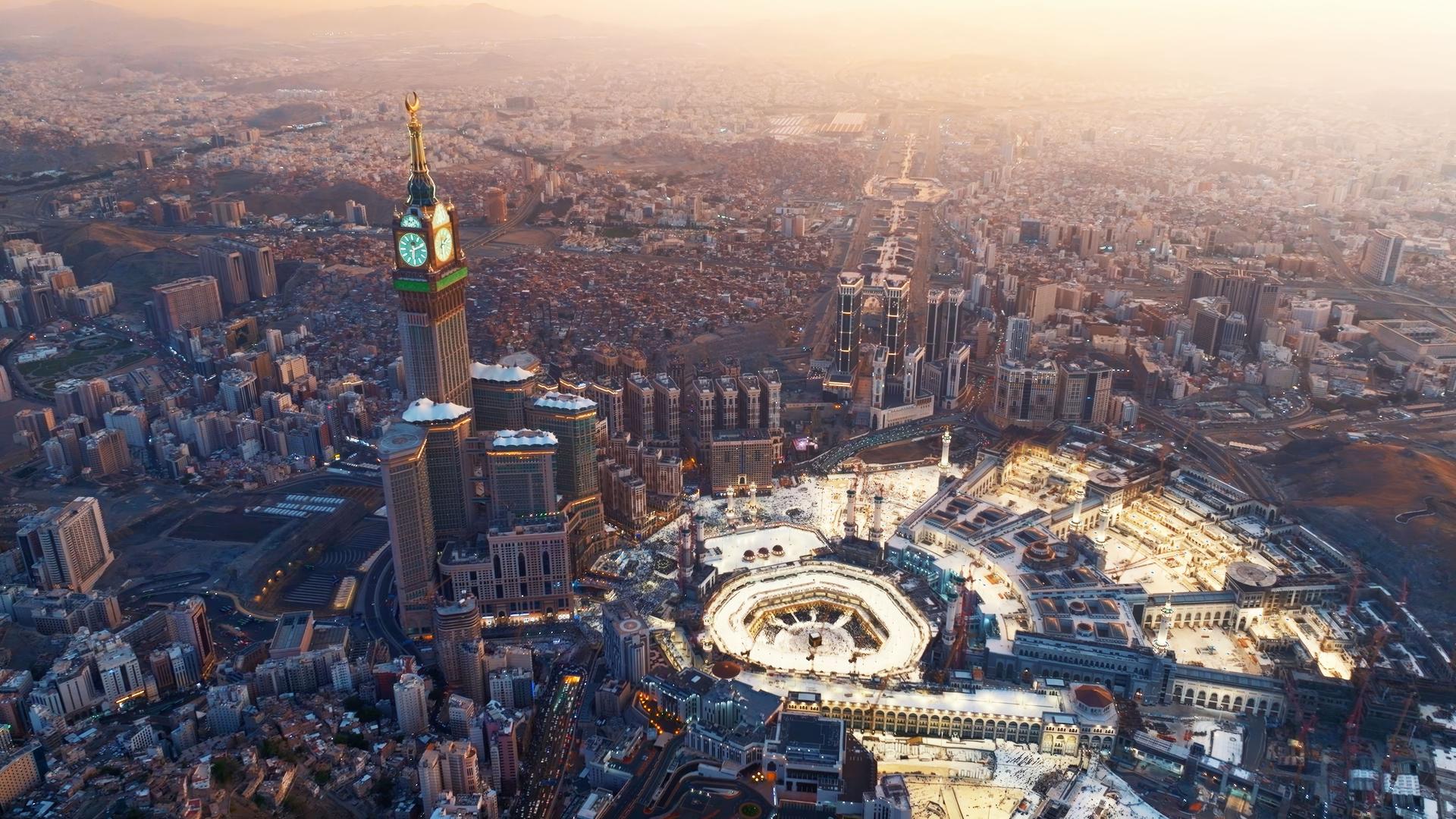 Aerial view of the Kaaba and Abraj Al-Bait Clock Tower in Mecca at sunrise